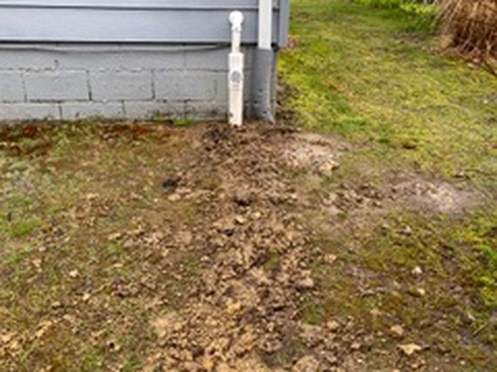 Discharge line routing outside the home by Sferra Waterproofing